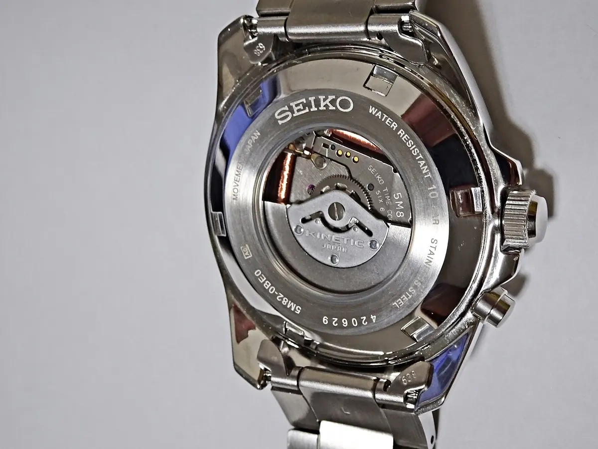 Back of a Seiko watch with a screw-down case back and display window